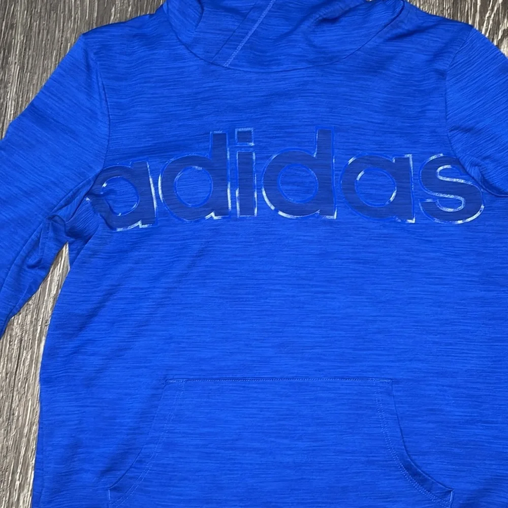 Girls royal blue adidas long sleeve shirt with a hood. Dri fit material size xl